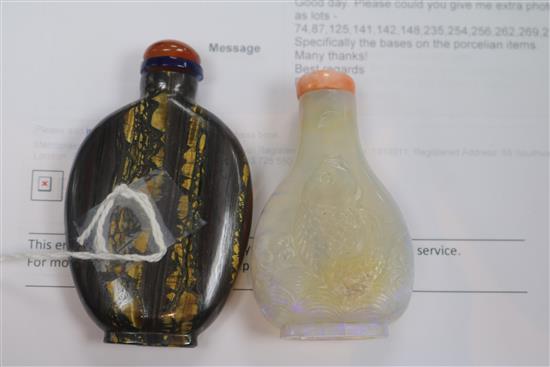 A Chinese carved opal snuff bottle and tigers eye mineral snuff bottle, early 20th century 6.5cm and 7.1cm